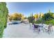 Backyard pool with lush landscaping and outdoor seating area at 308 Bayswater Ct, Las Vegas, NV 89145