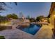 Swimming pool with water feature and luxurious landscape at 308 Bayswater Ct, Las Vegas, NV 89145