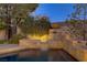 Poolside fountain feature with greenery and elegant stone surround at 308 Bayswater Ct, Las Vegas, NV 89145