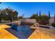 A swimming pool with a unique water feature and luxurious landscape at 308 Bayswater Ct, Las Vegas, NV 89145