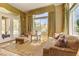 Inviting sitting room featuring large windows, patterned seating, and scenic views for relaxation at 308 Bayswater Ct, Las Vegas, NV 89145