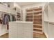 Spacious walk-in closet featuring custom shelving, storage, and central island with drawers for optimal organization at 308 Bayswater Ct, Las Vegas, NV 89145