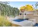 Elegant water feature with stone detailing and lush greenery, adding a touch of luxury to the outdoor space at 308 Bayswater Ct, Las Vegas, NV 89145