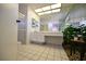 Spacious bathroom with double sinks and pebble floor at 3126 Asoleado Cir, Las Vegas, NV 89121