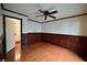 Bedroom with wood flooring, ceiling fan and adjacent bathroom at 3126 Asoleado Cir, Las Vegas, NV 89121