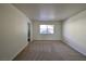 Bright bedroom with carpet and large window at 3126 Asoleado Cir, Las Vegas, NV 89121