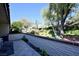 Landscaped courtyard with lush greenery and open space at 3126 Asoleado Cir, Las Vegas, NV 89121