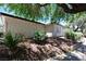 An exterior angle shows a charming home with textured stucco, a dark roofline, and mature desert landscaping at 3126 Asoleado Cir, Las Vegas, NV 89121