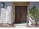 Inviting double door entry with decorative wreath at 3126 Asoleado Cir, Las Vegas, NV 89121