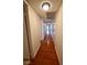 Long hallway with hardwood floors and access to bedrooms at 3126 Asoleado Cir, Las Vegas, NV 89121