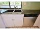 Kitchen with stainless steel dishwasher and granite counters at 3126 Asoleado Cir, Las Vegas, NV 89121