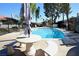 Relaxing pool area with seating and umbrella at 3126 Asoleado Cir, Las Vegas, NV 89121