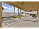 Covered patio with ceiling fan, artificial turf and shed at 319 Horse Pointe Ave, North Las Vegas, NV 89084