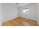 Simple bedroom with bamboo flooring and window at 319 Horse Pointe Ave, North Las Vegas, NV 89084