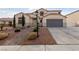 House exterior with a walkway and attached garage at 319 Horse Pointe Ave, North Las Vegas, NV 89084