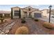 Two-story house with walkway, landscaping, and a gray garage door at 319 Horse Pointe Ave, North Las Vegas, NV 89084