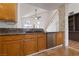 Kitchen with wood cabinets and granite countertops at 319 Horse Pointe Ave, North Las Vegas, NV 89084