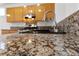 Granite countertops and stainless steel appliances in this kitchen at 319 Horse Pointe Ave, North Las Vegas, NV 89084