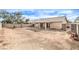 Large backyard with covered patio and block wall at 320 Mindoro Ave, North Las Vegas, NV 89031