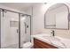 Updated bathroom with walk-in shower, modern vanity, and stylish fixtures at 320 Mindoro Ave, North Las Vegas, NV 89031