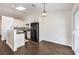 Modern kitchen with white cabinets and black appliances at 320 Mindoro Ave, North Las Vegas, NV 89031