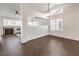 Living room with fireplace and herringbone wood floors at 320 Mindoro Ave, North Las Vegas, NV 89031