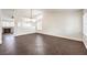 Bright and airy living room with herringbone floors at 320 Mindoro Ave, North Las Vegas, NV 89031