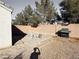 Large backyard with gravel, a grill, and a partially built patio at 3807 Aspen Creek Ave, North Las Vegas, NV 89031