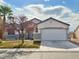 One-story house with attached garage and landscaping at 3807 Aspen Creek Ave, North Las Vegas, NV 89031