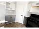 Modern kitchen with black appliances and gray cabinets at 3807 Aspen Creek Ave, North Las Vegas, NV 89031