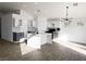 Modern kitchen with island, gray and white cabinets at 3807 Aspen Creek Ave, North Las Vegas, NV 89031