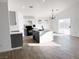 Modern kitchen with island, gray cabinets, and tile floors at 3807 Aspen Creek Ave, North Las Vegas, NV 89031