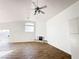 Open living area with fireplace and wood-look tile floors at 3807 Aspen Creek Ave, North Las Vegas, NV 89031