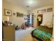 Second bedroom with a bed, toy area, and ample closet space at 3815 Juno Beach St # 203, Las Vegas, NV 89129