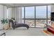 Bedroom with chaise lounge offering panoramic city views at 4471 Dean Martin Dr # 2000, Las Vegas, NV 89103