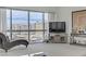 Living room boasts expansive windows with city views and comfortable seating at 4471 Dean Martin Dr # 2000, Las Vegas, NV 89103