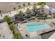 Aerial view showing the building's architecture, pool, courtyard, and lush landscaping at 4565 Dean Martin Dr # 102, Las Vegas, NV 89103