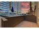 Spacious outdoor balcony with sunset views; perfect for relaxing and entertaining at 4565 Dean Martin Dr # 102, Las Vegas, NV 89103