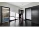 Ensuite bathroom with glass shower and a glimpse into the bedroom, creating a functional and bright space at 4565 Dean Martin Dr # 102, Las Vegas, NV 89103