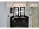 Contemporary bathroom with a dual sink vanity, expansive mirror, and walk-in shower at 4565 Dean Martin Dr # 102, Las Vegas, NV 89103