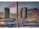 Scenic city view featuring high-rise buildings and mountains under a sunset sky at 4565 Dean Martin Dr # 102, Las Vegas, NV 89103