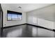 Sun-filled living area with dark hardwood floors and bright windows at 4565 Dean Martin Dr # 102, Las Vegas, NV 89103