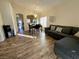 Bright dining area with hardwood floors and a view of the kitchen at 4604 Possum Berry Ln, North Las Vegas, NV 89081