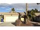 Single-story house with a white garage door and desert landscaping at 4604 Possum Berry Ln, North Las Vegas, NV 89081