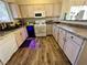 Modern kitchen with stainless steel appliances and ample counter space at 4604 Possum Berry Ln, North Las Vegas, NV 89081