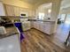 Well-equipped kitchen with light wood cabinets and modern appliances at 4604 Possum Berry Ln, North Las Vegas, NV 89081