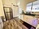 Bright kitchen with stainless steel refrigerator and light wood cabinets at 4604 Possum Berry Ln, North Las Vegas, NV 89081