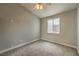 Neutral-toned bedroom featuring carpet flooring, ceiling fan, window with blinds, and ample natural light at 4731 Norwegian St, Las Vegas, NV 89147