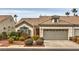 Charming single-story home with a well-manicured front yard and attached two-car garage at 4731 Norwegian St, Las Vegas, NV 89147