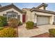 Welcoming single-story home with desert landscaping leading to the front entrance and a two-car garage at 4731 Norwegian St, Las Vegas, NV 89147